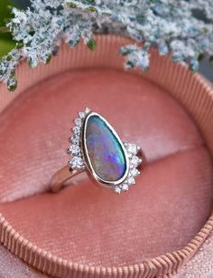 In ancient Rome, it was believed that opal brings love and hope. We have no doubt that it’s exactly the gem that symbolizes a strong alliance. We have created a custom engagement opal ring with diamonds for those who value love and reliability in the relationship. Creating the unique design of the ring we wanted to combine two symbols: infinity and Yin Yang, which are so meaningful for engagement rings.The best addition to dream ring is white gold and sparkling diamonds that give goddess ring a Relationship Rings, Opal Diamond Engagement Ring, Black Opal Engagement Ring, Unique Opal Ring, 14k Gold Opal Ring, Goddess Ring, Opal Promise Ring, Montana Sapphire Engagement, Montana Sapphire Engagement Ring