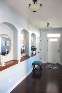 the hallway is clean and ready to be used as a place for pictures or photos