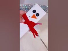 someone is making a snowman out of paper