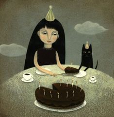 a woman sitting at a table with a cake and cat