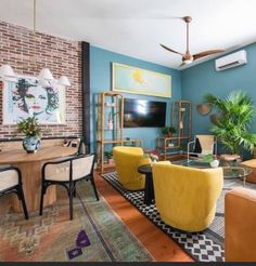 a living room filled with furniture and a flat screen tv mounted on the wall above a fireplace