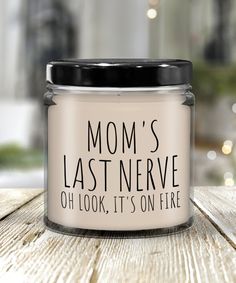 a candle that says mom's last nerve oh look it's on fire