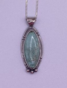 "Turquoise from Nevada and Sterling Silver pendant.  The color in this piece is a slight blue-green color. Slight inclusions lend to the authenticity of this turquoise piece.  It measures approximately 1-1/2\" height including the bail x 1/2\" wide.  This piece comes with an 18\" sterling silver chain" Turquoise Necklace With Large Oval Pendant, Turquoise Necklace With Large Oval Stone, Turquoise Necklace With Large Oval Stone Pendant, Collector's Turquoise Necklace With Round Pendant, Collectible Blue Turquoise Necklace With Large Pendant, Collectible Turquoise Necklace With Round Pendant, Collectible Turquoise Round Pendant Necklace, Blue Turquoise Necklace With Large Pendant, Green Turquoise Necklace With Large Sterling Silver Pendant