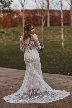 Bride in a long sleeve wedding dress with train and intricately detailed sequin back for winter wedding Wedding Dress Winter, Wedding Dress With Train, Snowy Wedding, Lee Daniels, Wedding Stone, Black Bridesmaid, Dress With Train