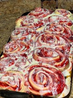 a pan filled with lots of different types of food on top of a countertop