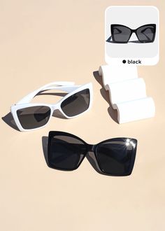 three pairs of sunglasses sitting next to each other