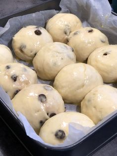 some doughnuts are in a pan and ready to be baked into buns