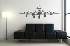 a black and white wall decal with a helicopter on it's side in a living room