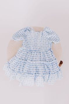 This adorable dress features a sweet blue gingham design, playful puffy sleeves, and charming heart accents. Plus, the delicate smocking adds a touch of elegance to this little blueberry bonnet dress. Perfect for your little one's next photo op or special occasion. Baby Bonnets, Blue Gingham, Photo Op, Puffy Sleeves, Baby Dress, Baby Blue, Cute Dresses, Smocking, Dresses For Sale