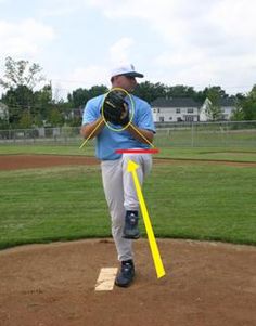 a man holding a baseball bat on top of a pitchers mound in a game field