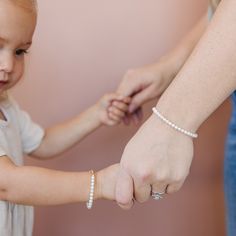 This freshwater pearl bracelet is the perfect gift for any special occasion. It is elegant and classy, featuring freshwater pearls. Whether you’re buying for mommy and me, or your baby girl or toddler, our matching bracelets are the perfect way to show your love. With these timeless pieces, your loved one can look back on these memories for years to come. This pearl bracelet is made with 5mm creamy white freshwater pearls. Being real freshwater pearls they are more sensitive to wear and tear. If Baby Bracelet, Freshwater Pearl Bracelet, White Freshwater Pearl, Matching Bracelets, Creamy White, Mommy And Me, Pearl Bracelet, Handmade Bracelets, Timeless Pieces