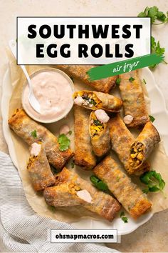 southwest egg rolls on a plate with ranch dip and cilantro sauce in the background