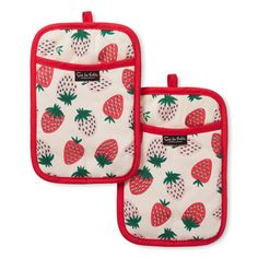 two oven mitts with red trims and pineapple print on them, one has a