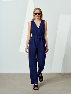 Linen wrap jumpsuit. Wrap design forms a trendy V-neck and adds a sense of easy elegance for his sleeveless linen overall. Its belt goes around the elastic waistline through wide belt loops. The linen romper has a hidden zipper in the back to make the dressing easier. Side pockets add extra convenience. With this maxi linen jumpsuit you can go to the summer office, cocktail party or exhibition opening as well as dress up on vacation. You will look flawless and stylish all the time. STYLE DETAILS Summer Vacation Linen Jumpsuits And Rompers, Summer Beach Linen Jumpsuits And Rompers, Summer Linen Jumpsuits And Rompers For Vacation, Elegant Sleeveless Linen Jumpsuit, Summer Linen Jumpsuits And Rompers With Pockets, Chic Linen Jumpsuits And Rompers For Summer, Sleeveless Denim Jumpsuit For Summer Workwear, Chic Relaxed Fit Denim Jumpsuit For Summer, Sleeveless Linen Summer Jumpsuit