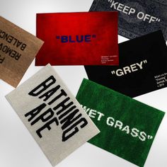 five different types of cloth labels on a white surface with the words blue, grey, green and red