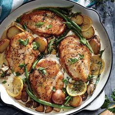 a pan filled with chicken, potatoes and green beans