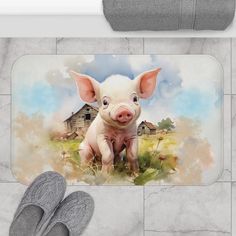 a pair of gray slippers sitting on top of a floor next to a pig rug