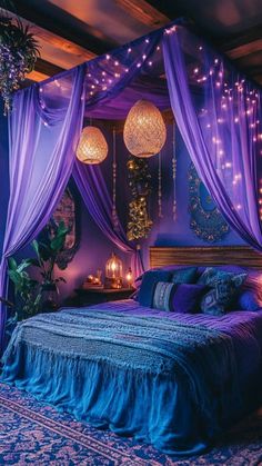 a bed with purple drapes and lights on it