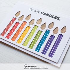 a card that has candles on it and the words, the more candles are in different colors