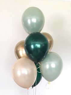 a bunch of balloons that are in the air