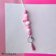 This listing is for one pink flamingo theme teacher break-away detachable lanyard/ ID badge holder with keychain clip.  It measures 23 inches long and is made with silicone beads and a tassel.  The beads are shown in a pink and white design with a matching pink tassel. Other lanyard designs are also available. Please check my store. I also love to do custom orders! Flamingo Theme, Keychain Clip, Teacher Lanyard, Pink Tassel, Id Badge Holders, Pink Flamingo, Silicone Beads, Id Badge, Badge Holders Lanyard