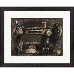 an old fashioned sewing machine is framed in black and gold with ornate trimmings