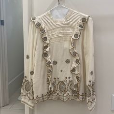 Long Sleeve Cream Blouse With Embroidery Detailing. Nwt. Size Xs. Fits Like A Size Xs Or S Chic Embellished Beige Tops, Chic Beige Embellished Tops, Festive Long Sleeve Tops With Intricate Embroidery, Festive Long Sleeve Blouse With Pearl Embroidery, Chic Cream Tops With Floral Embroidery, Elegant Embroidered Beige Tops, Long Sleeve Blouse With Pearl Embroidery, White Embellished Long Sleeve Tops, Elegant Cream Tops With Intricate Embroidery