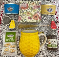 the contents of a tea gift box are laid out