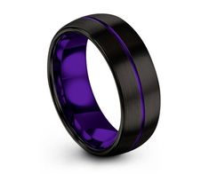 black and purple ceramic ring with an interior inlayed to the center, on a white background