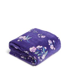 a purple blanket with flowers on it