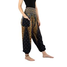 Harem pants with peacock design in black and gold With wide waistband and airy cut, the pants are flexible and comfortable. There is flexible elastic at the hips and ankles. These pants are light and airy and offer maximum freedom of movement. All our harem pants are unisex cut and suitable for any body shape, from petite to plus size. On the left side there is a patch pocket in about 14x14 cm. Cozy and practical at the same time: Viscose is an easy-to-care-for fabric with great properties; The Sewing Factory, Cozy Pants, Womens Trousers, Peacock Design, Summer Pants, Wide Waistband, Perfect Summer, Black And Gold, Fair Trade