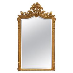 an ornate gold framed mirror against a white background