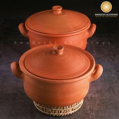 two clay pots sitting on top of each other in front of a black background with the words swadeseshi blesings