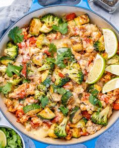 a skillet with broccoli, cauliflower and other vegetables in it