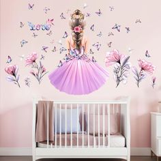 a baby's room with pink walls and butterflies on the wall