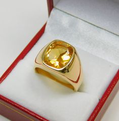 Gemstone: Golden Citrine Treatments: None Measures: 12x10mm Weight: 3.72 carats Clarity: Eye clean Cut: Rectangle cushion cut Metal: Shown in 18K yellow gold Weight: Approx. 20 -22 grams Ring size: This ring is available in all sizes from a low of 5 to a high of 12 This is as fine and elegant a man's ring as you will ever find. The perfect blend of a fine gemstone matched up with a clean classic 18K yellow gold ring. Good solid weight, nicely distributed to give the ring an even weight so that i Yellow Stone Ring Men, Gold Ring With Stone For Man, Yellow Sapphire Ring Men Gold, Yellow Sapphire Ring Men Design, Men Gemstone Ring Design, Yellow Signet Ring With Polished Finish For Formal Occasions, Classic Yellow Signet Ring With Polished Finish, Classic Gold Citrine Signet Ring, Classic Yellow Hallmarked Signet Ring