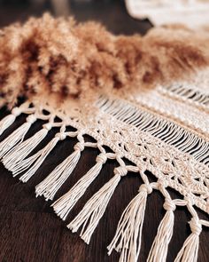 an image of a table runner with fringes on it