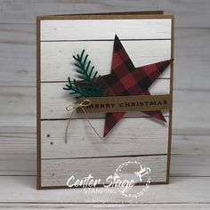 a christmas card with a red and black plaid star on it, tied to a wooden background