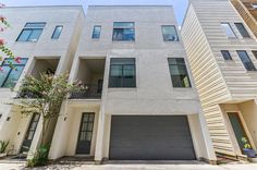 two story apartment building with garages on each side