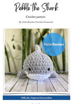 a crocheted stuffed animal with the words pebble the shark written on it