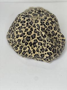 This hat is adjustable and it a low profile fit. Trendy Fitted Hat With Flat Brim, Casual Flat Brim Hat With Adjustable Fit, Casual Adjustable Flat Brim Hat, Casual Flat Brim Adjustable Hat, Casual Flat Brim Hat Adjustable, Trendy One Size Fits Most Fitted Hat, Casual Brown Flat Cap Trucker Hat, Casual Hats With Short Brim, Adjustable Casual Snapback Hat