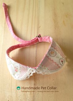 a close up of a pink and white bra