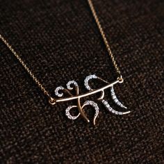 "Hand lettered Hindi name necklace pendant, crafted in 14k solid gold and genuine natural diamonds, this personalized necklace makes a unique customized gift for one and all. * Diamond Wt : 0.21-0.25 ct (approx) * Diamond Color-Clarity Grade : H I -Vs Si * Gold - 2.5g, 14k yellow gold * Pendant Width : 1 inch * Pendant Height : Will vary depending on the name length * Chain Length - 14-18\" cable chain P.S. The design will be finalized with you through sketches before starting manufacturing. Fin Diamond Name Necklace In White Gold For Gift, Diamond Name Necklace In White Gold, White Gold Diamond Name Necklace Gift, White Gold Diamond Name Necklace As Gift, Luxury Diamond Name Necklace As Gift, Diamond Nameplate Jewelry With Initials, Yellow Gold Initial Pendant Necklace With Diamond Accents, Luxury Diamond Engraved Name Necklace, Traditional Engraved Diamond Jewelry