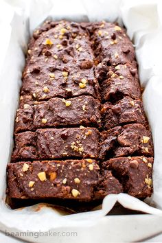 chocolate brownies in a white paper container