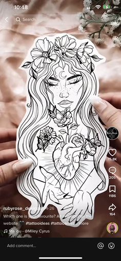 a person holding a sticker with flowers on it