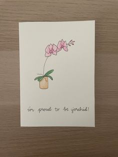 a greeting card with pink flowers in a vase