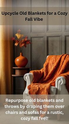 an orange blanket sitting on top of a white chair