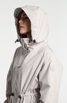 Travel confidently and comfortly in wet weather with this waterproof rain jacket designed for easy packing and breathability. 35" front length; 38" back length (size Medium) Drawcord-toggle hood Drawcord-toggle waist Waterproof Lined 100% polyester Machine wash, tumble dry Imported White Nylon Raincoat For Rainy Weather, Functional Waterproof Raincoat For Rainy Season, White Nylon Travel Outerwear, Functional Outerwear With Double-lined Hood For Rainy Weather, Functional Raincoat For Rainy Season, Functional Raincoat With Adjustable Hood For Rainy Season, Sporty Weatherproof Raincoat For Travel, Casual Raincoat For Rainy Season Outdoor Activities, Casual Raincoat For Rainy Season Travel