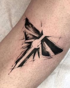 a black and white tattoo on the arm of a person with a cross in it