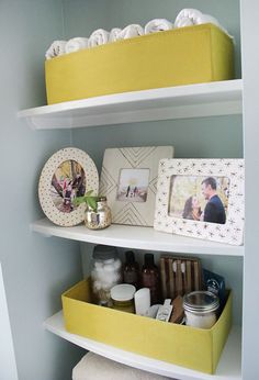 the shelves are filled with personal care items and other decorative items, such as photos